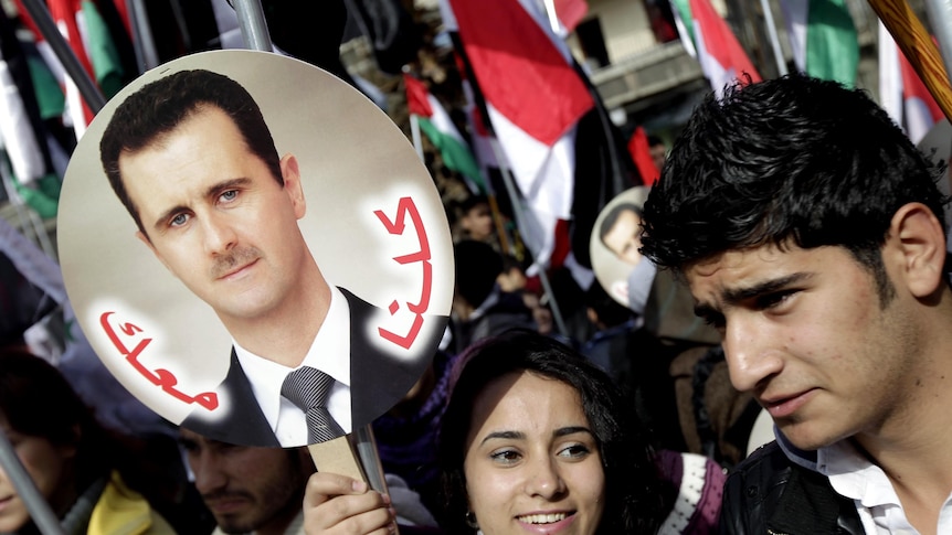 Assad supporters in Damascus (AFP: Joseph Eid, file photo)