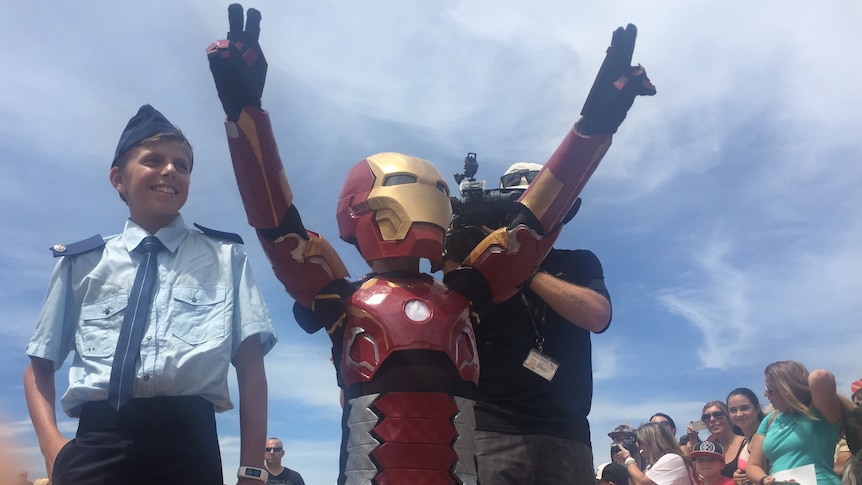Iron Boy celebrates after saving Sydney from Ultron at the Sydney Opera House.