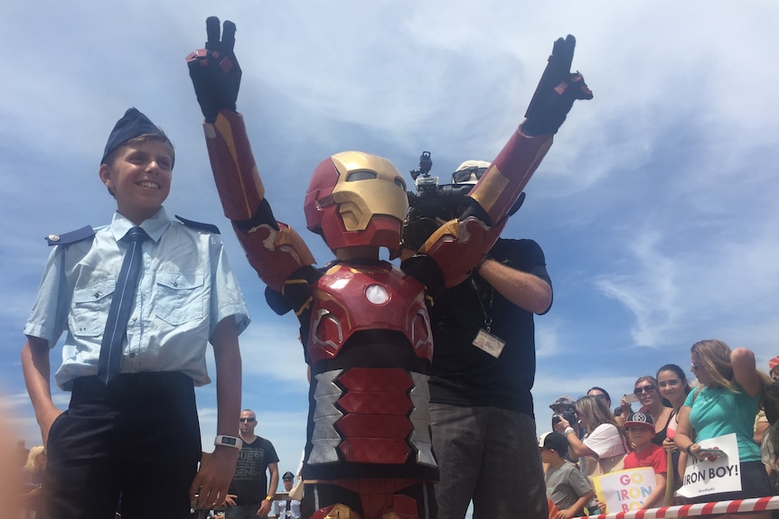 Iron Boy celebrates after saving Sydney from Ultron at the Sydney Opera House.