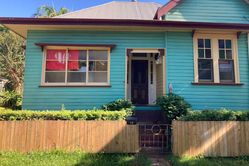 flood affected home with new timber fence