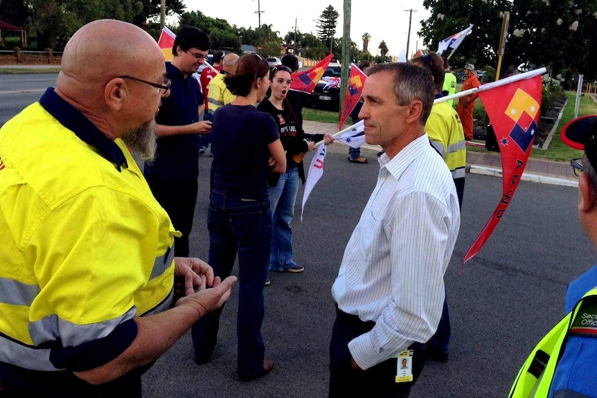 Workers protest outside WesTrac's headquarters in Guildford over the loss of 400 jobs.