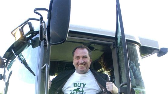 Queensland Nationals Senator Barnaby Joyce arrives at Parliament House Canberra by tractor