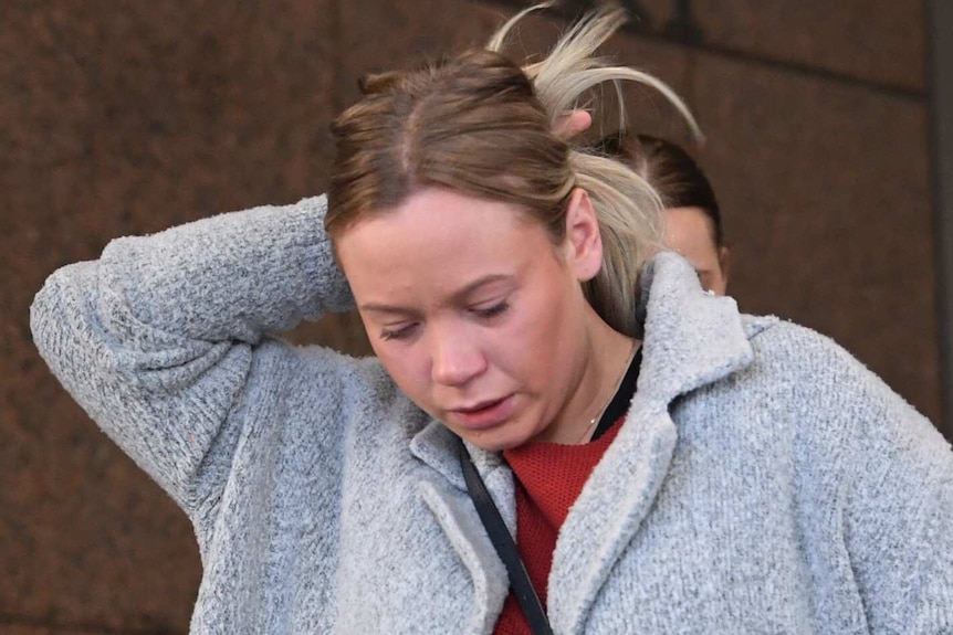 Emma Kent looks down as she walks out of Melbourne Magistrates' Court.