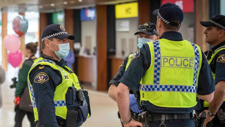 Police standing at an airport