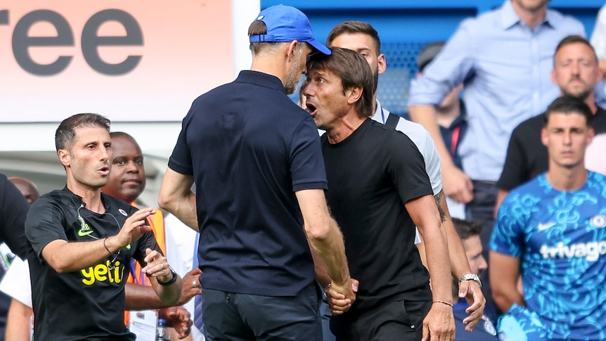 Tottenham and Chelsea managers Thomas Tuchel and Antonio Conte have their faces very close together as they clash at a game.
