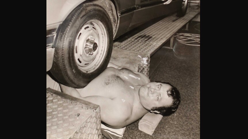An old picture of Leon Samson with the full weight of a car on his stomach.
