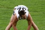 Ben Cousins stretches during a training session
