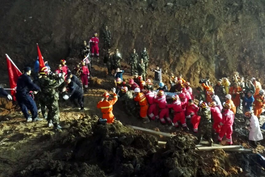 Rescuers carry out Shenzhen landslide survivor