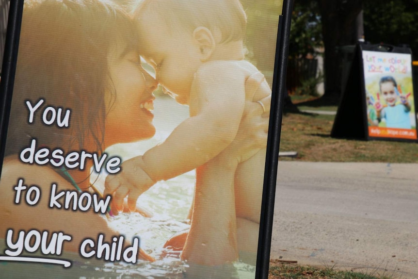 A corflute sign that reads "You deserve to know your child".