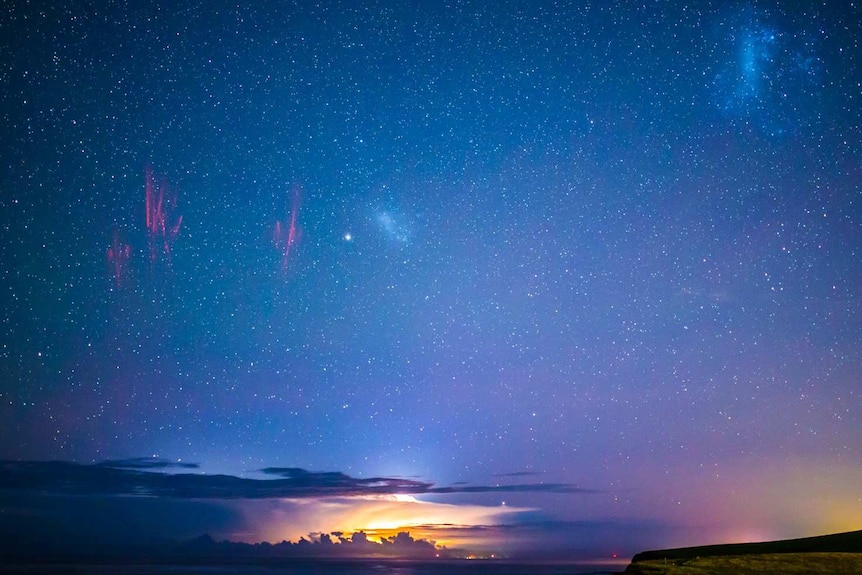 A panorama view from Kiama looking south with visible space lightning.