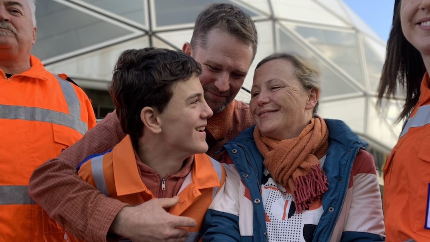 A smiling William Callaghan with his parents 