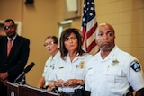 Minneapolis Police Chief Janee Harteau addresses a media conference with her assistants beside her.