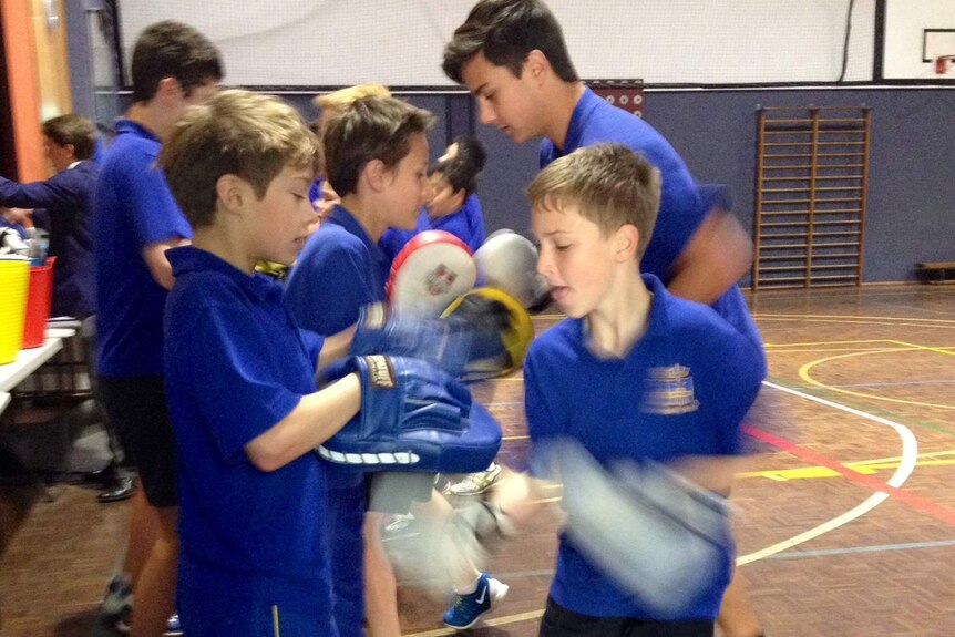 Students at St Pius X College in Sydney's north attend boxercise classes before school.