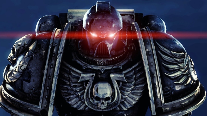 A large robot with a skull on his chest armour shines red laser beams from his eyes