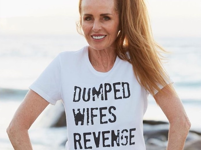 a woman sitting on rocks with a shirt that says dumped wifes revenge