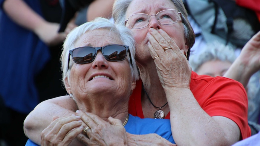 Two women hug while celebrating the yes vote in the same-sex marriage postal survey.