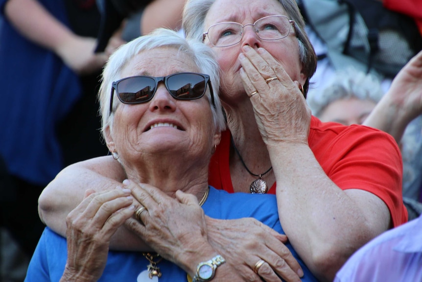 Two women hug while celebrating the yes vote in the same-sex marriage postal survey.