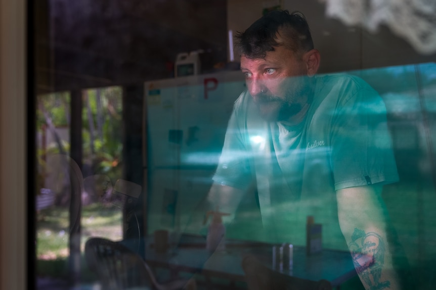 Peter Jackson looks out the window with a sad expression on his face.