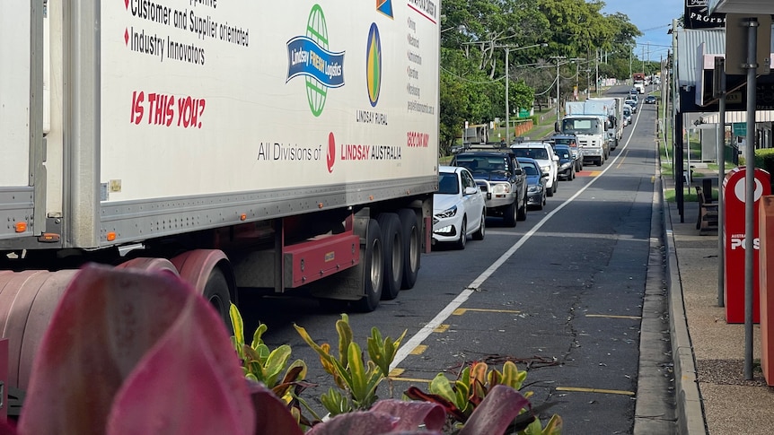 Line of cars stuck in traffic on suburban road