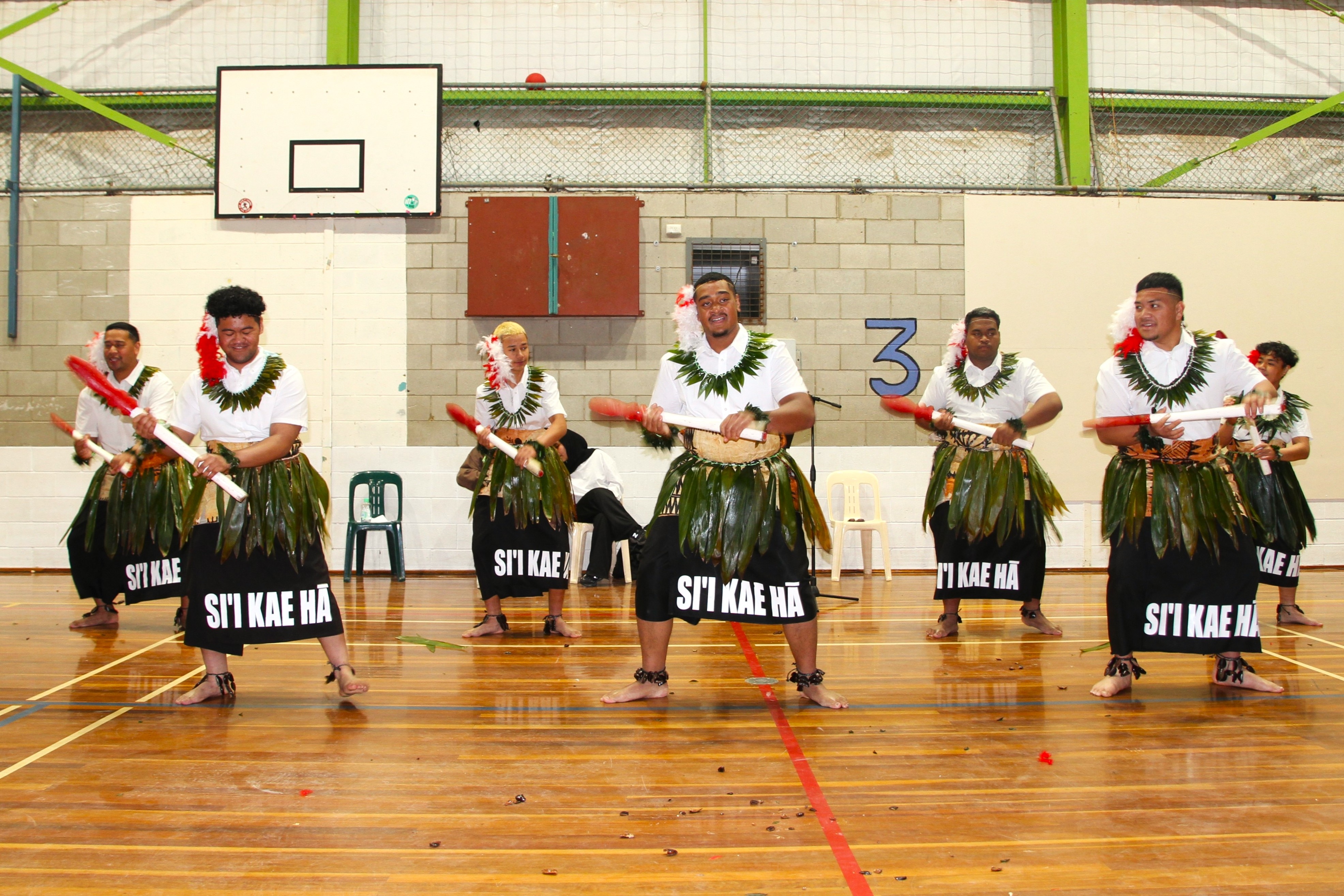 Seven boys part of the Si'i Kae Ha dance group dance their traditional dances.