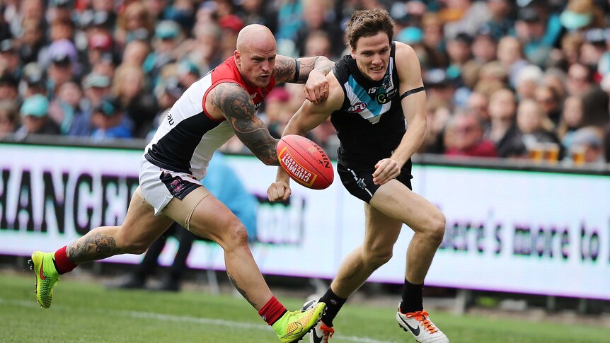 Melbourne's Nathan Jones competes with Port Adelaide's Jared Polec at Adelaide Oval.