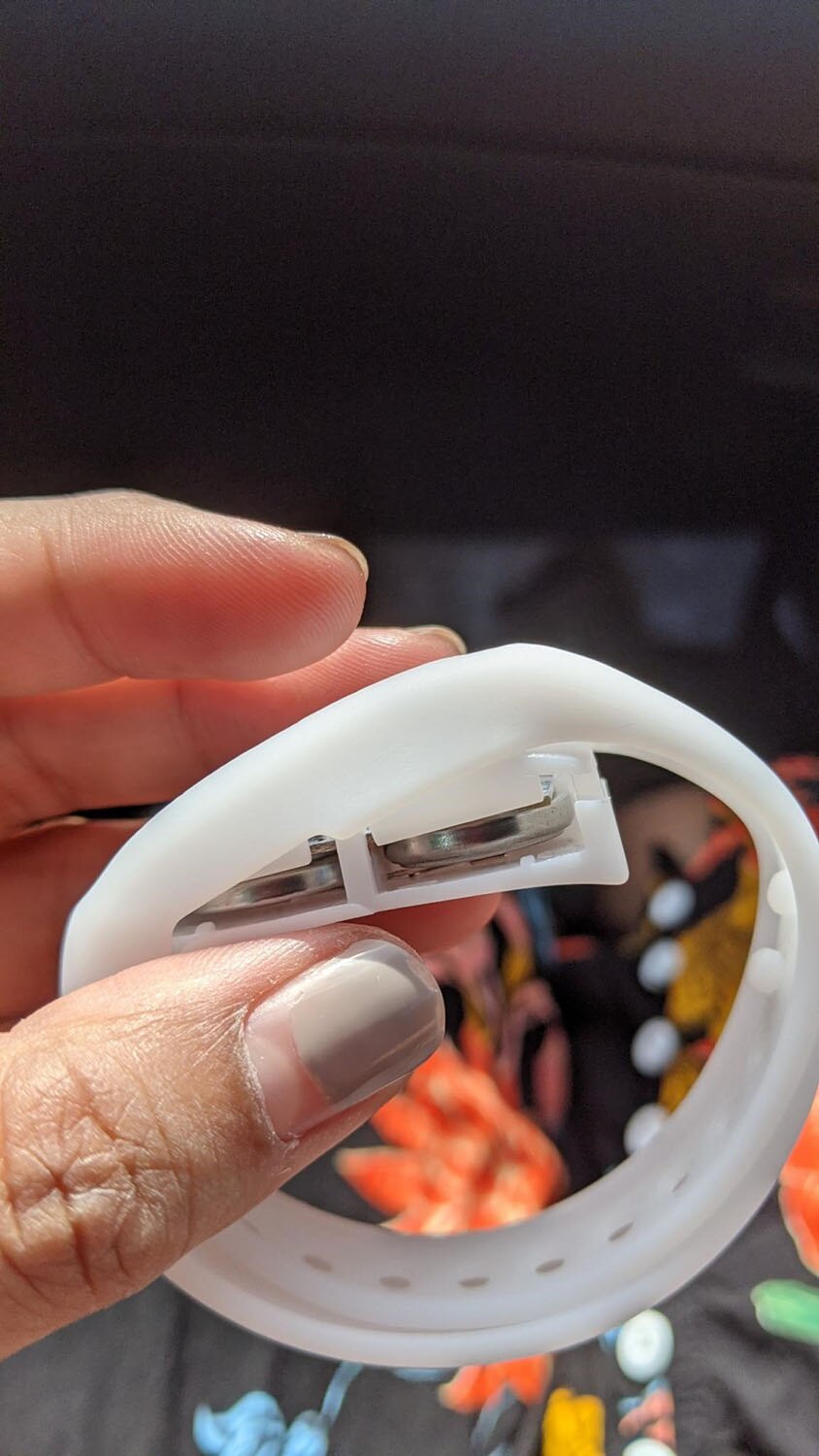 Free AFL wristbands with button batteries recalled by ACCC amid child