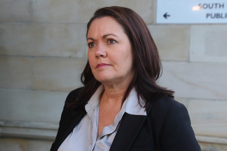 A mid shot of WA Opposition Leader Liza Harvey standing outside Parliament listening to a question from an unseen reporter.