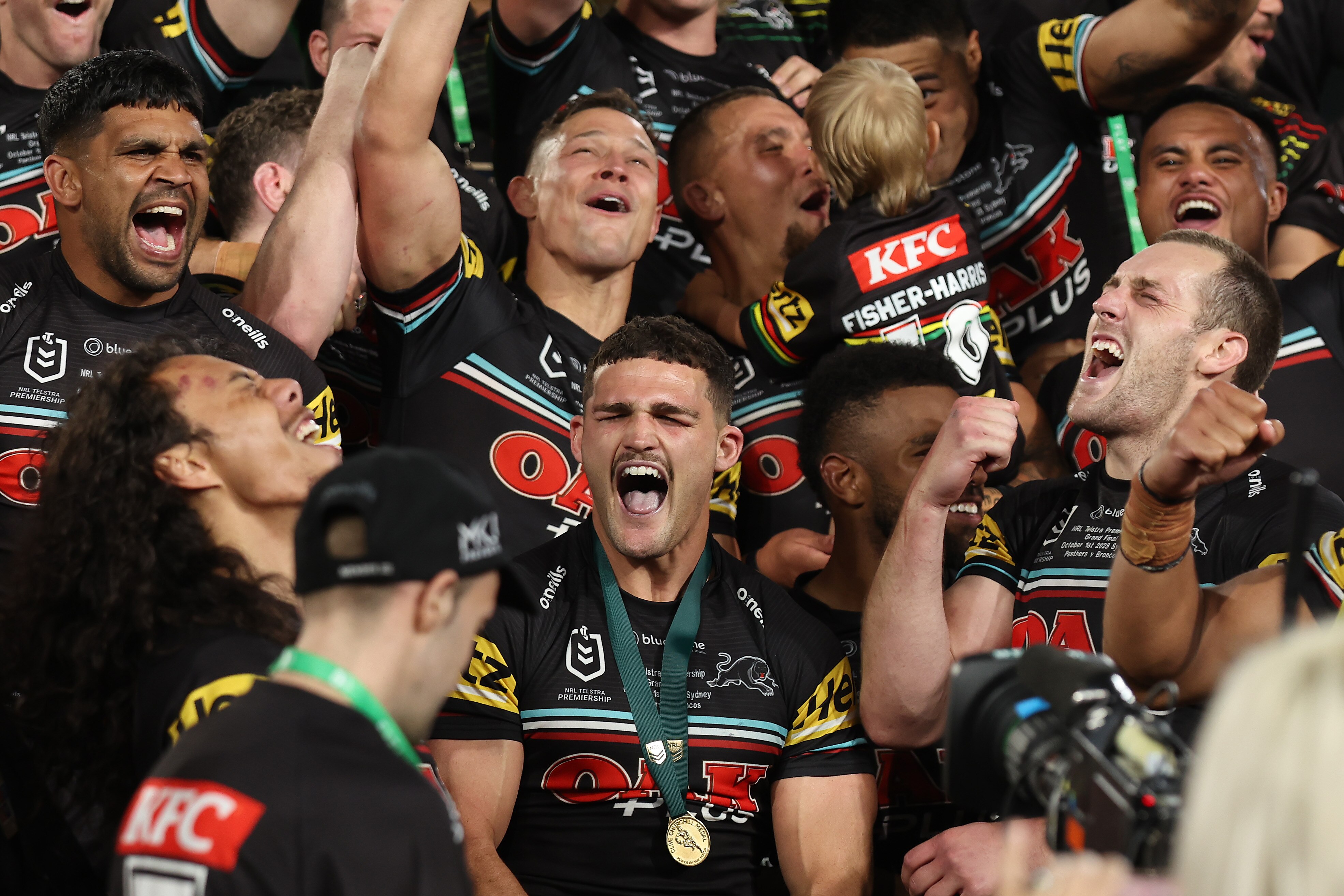 A team celebrates a grand final victory