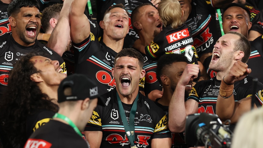 A team celebrates a grand final victory