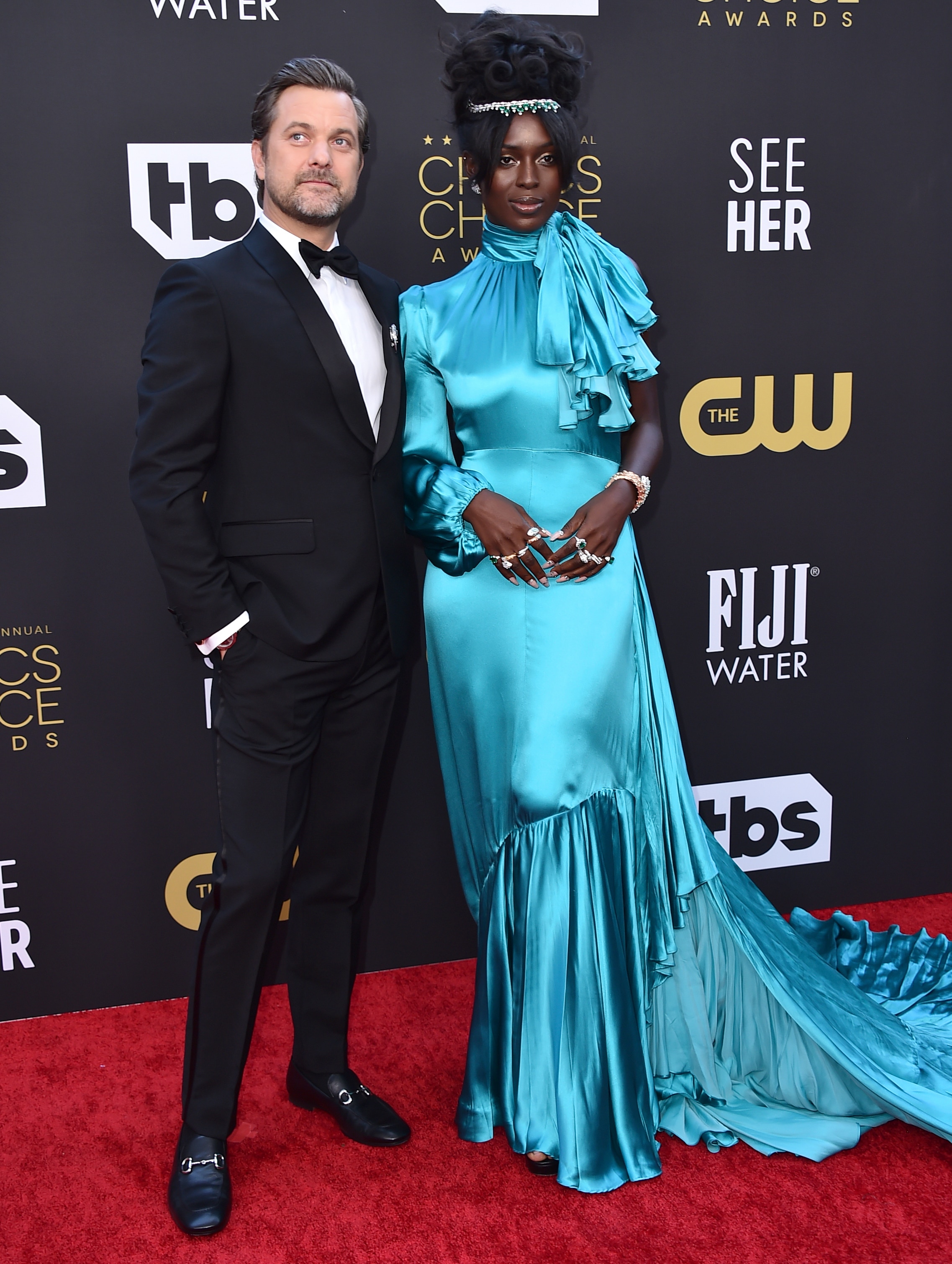 Joshua Jackson and Jodie Turner-Smith pose together on a red carpet