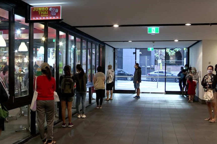 People lined outside a thai restaurant