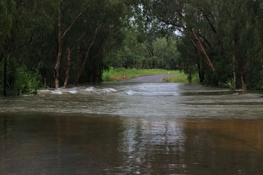 Water rushing over a floodway on Darwin River Dam Road.