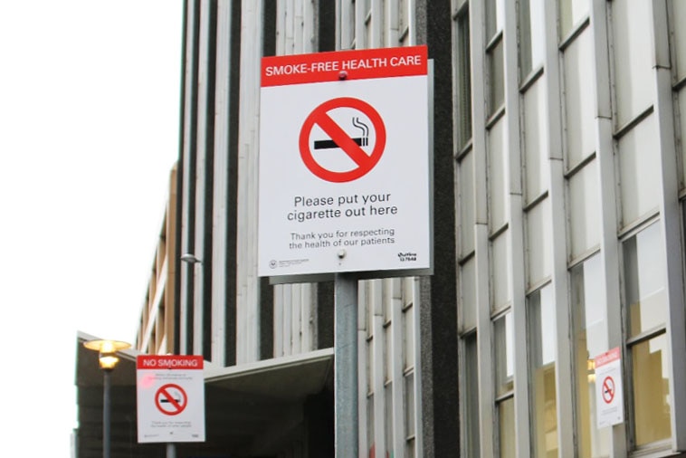 Smoke free health care signage outside a hospital.