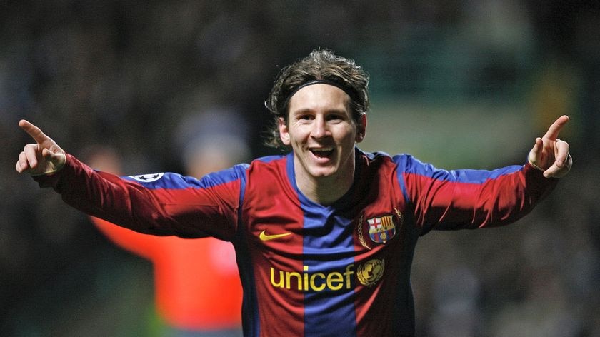 Lionel Messi celebrates scoring for Barcelona