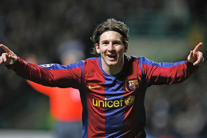 Lionel Messi celebrates scoring for Barcelona