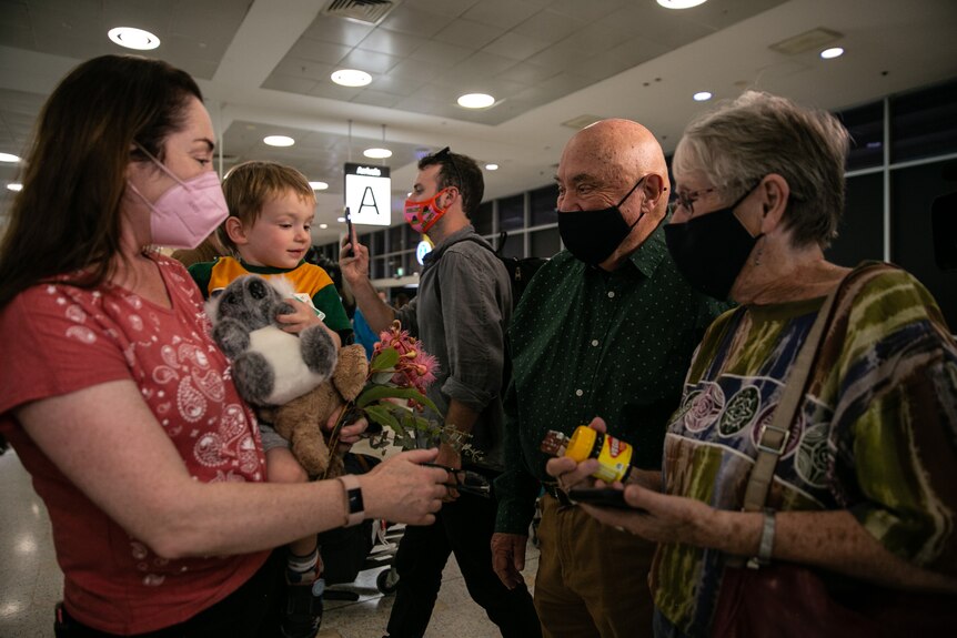 A family reunites at Sydney Airport