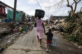 Mother and son leave home: Haiti
