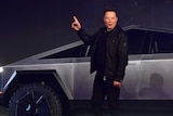 Tesla co-founder and CEO Elon Musk gestures while unveiling the Cybertruck.
