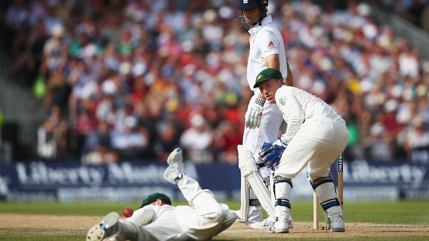 England's Alistair Cook looks on as Australia's Michael Clarke fails to take a catch on day two.