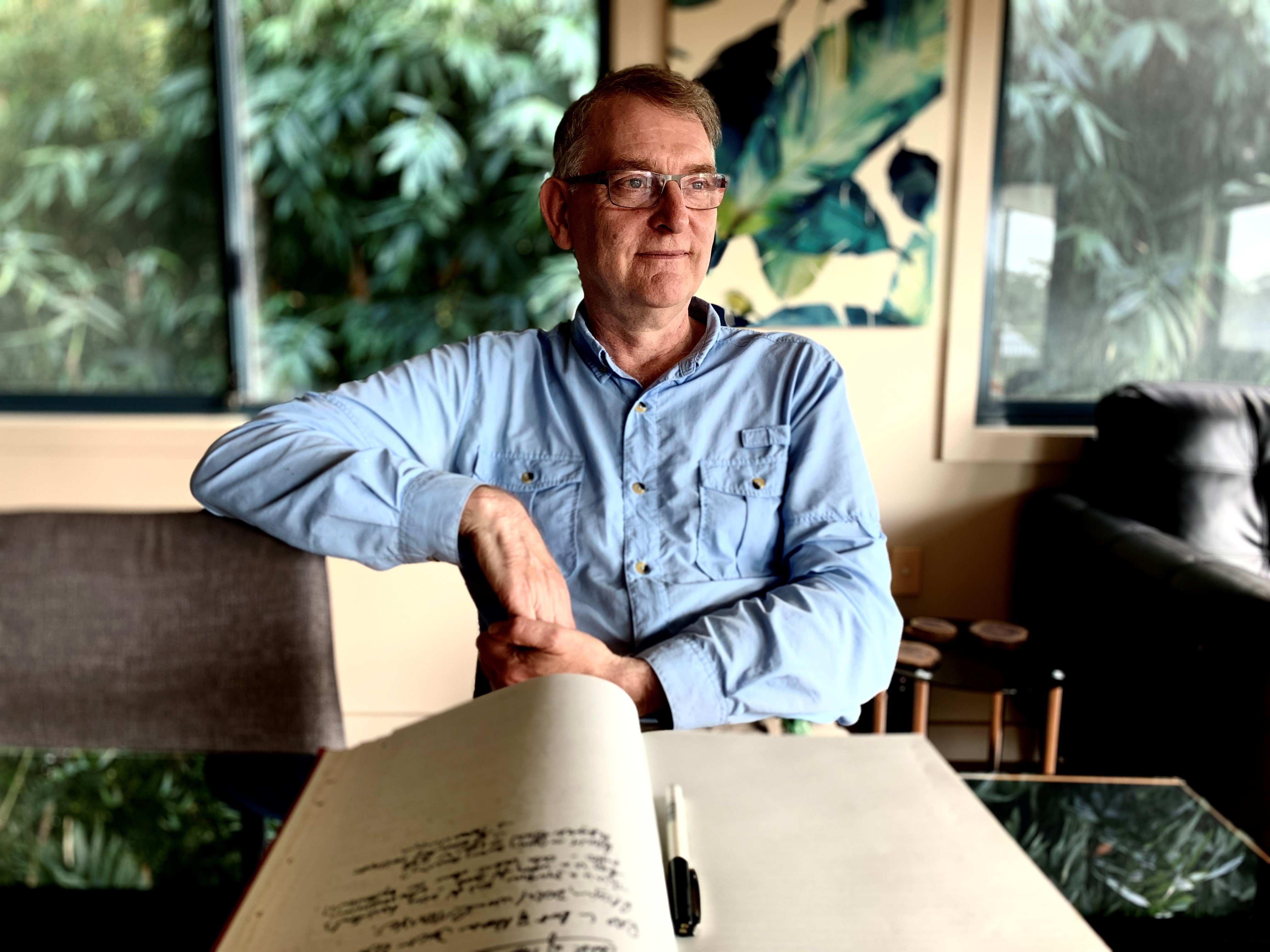 Housing analyst Martin North sits at his desk and gazes out the window.