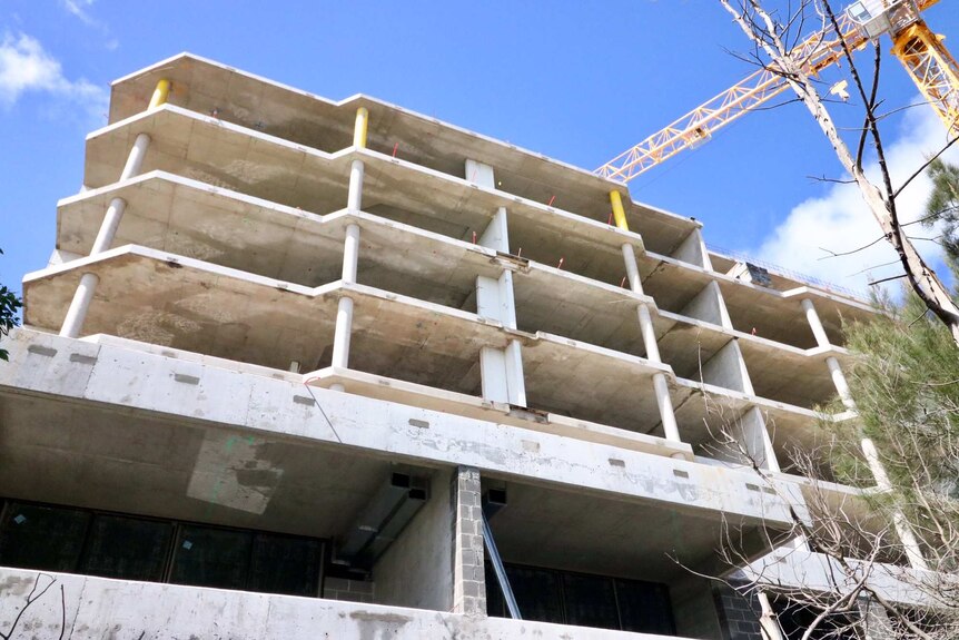 This apartment building site in Cronulla has sat vacant for several months after the developer went bust.