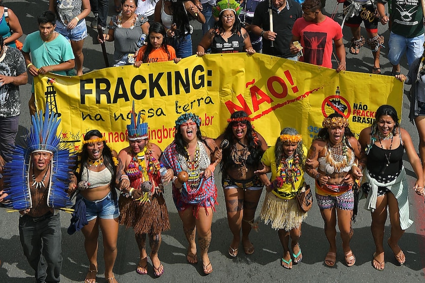 An aerial view of indigenous protesters in Brazil during a street march.