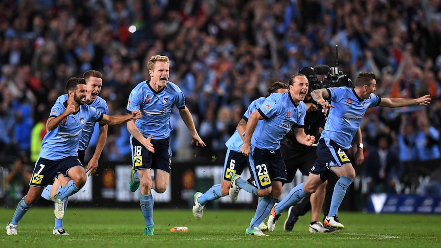 Sydney FC celebrates defeating Melbourne Victory in a penalty shootout in the A-League grand final.