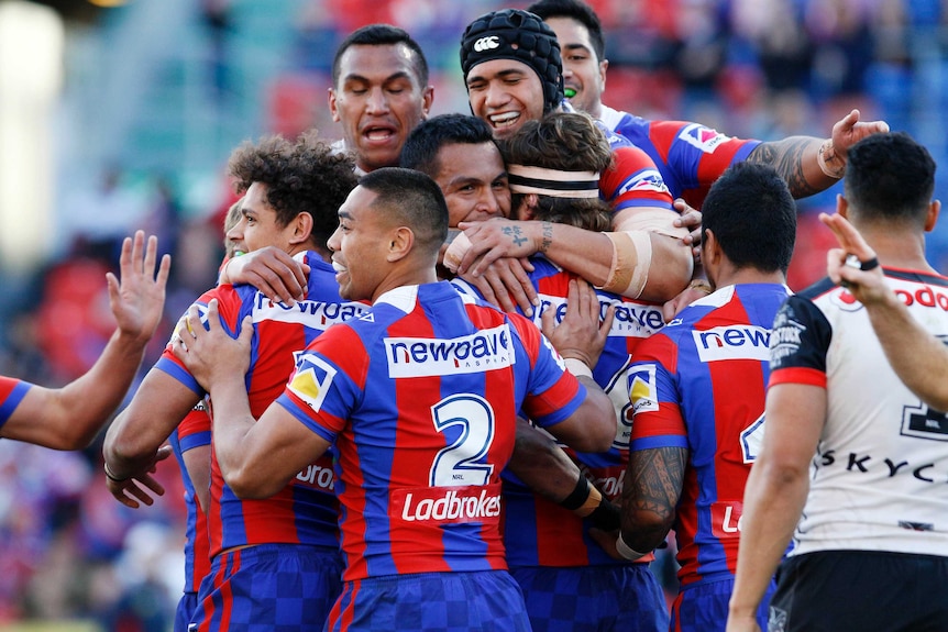 Knights celebrate try against Warriors