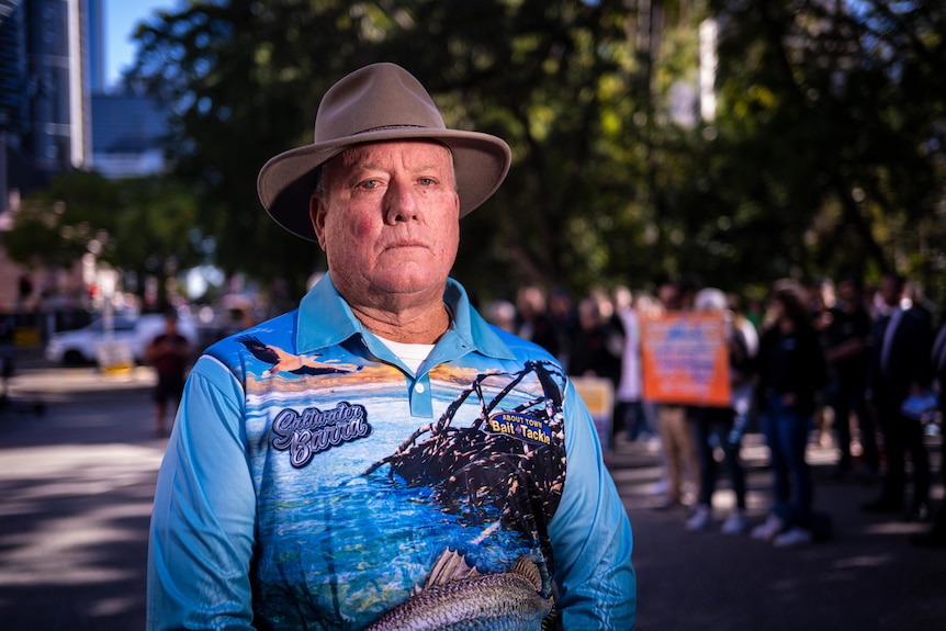 A sad fisherman at a protest