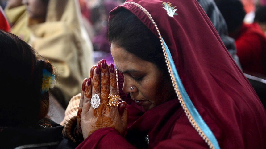 Pakistani Christians offer prayers during Christmas mass.