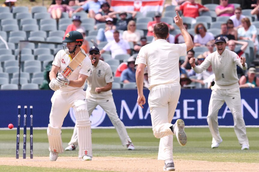 Chris Woakes celebrates his dismissal of Shaun Marsh on day four of the second Ashes Test at Adelaide Oval.