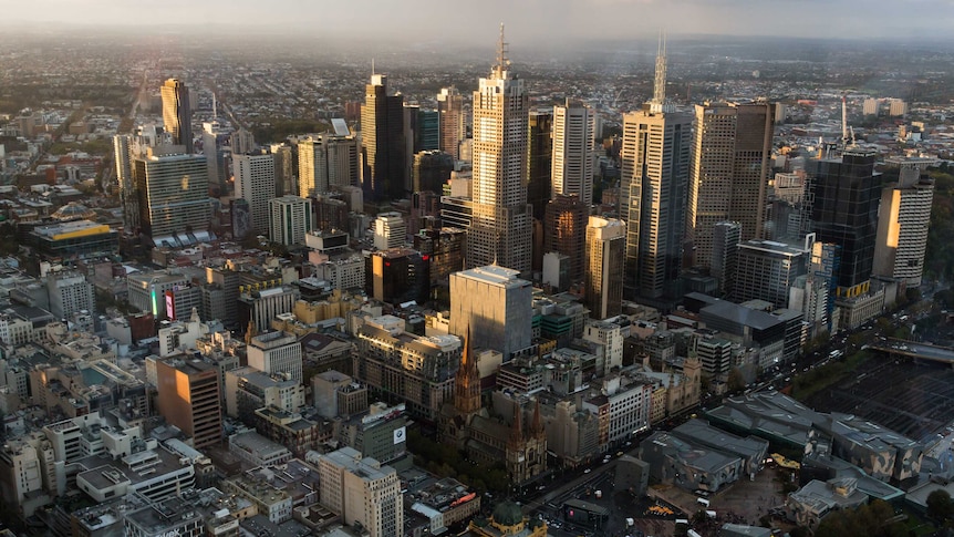 An aerial shot shows skyscrapers in Melbourne's CBD.