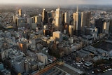 An aerial shot shows skyscrapers in Melbourne's CBD.