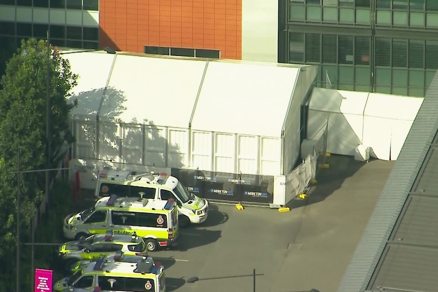 Aerial of COVID triage tents marquees and ambulances outside Gold Coast University Hospital at Southport